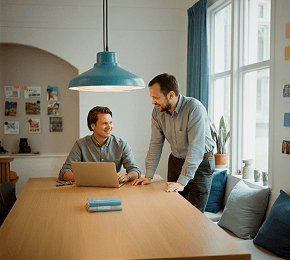 Two professionals discussing strategy at a desk